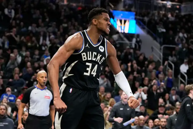 Milwaukee Bucks' Giannis Antetokounmpo reacts after a dunk during the second half of an NBA Cup quarterfinals basketball game against the Orlando Magic Tuesday, Dec. 10, 2024, in Milwaukee.