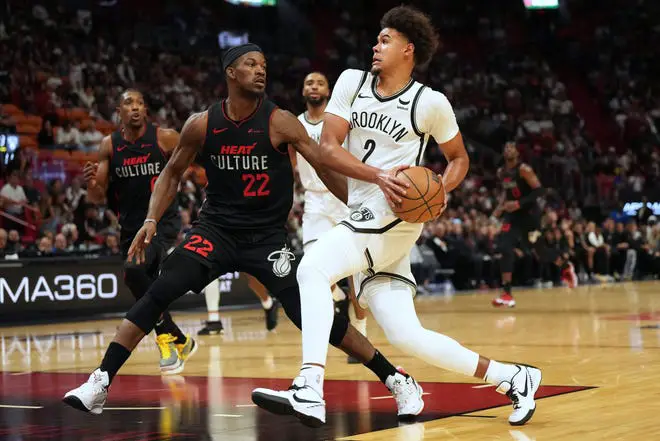 Nov 16, 2023; Miami, Florida, USA; Brooklyn Nets forward Cameron Johnson (2) drives to the basket as Miami Heat forward Jimmy Butler (22) defends in the second half at Kaseya Center. Mandatory Credit: Jim Rassol-USA TODAY Sports